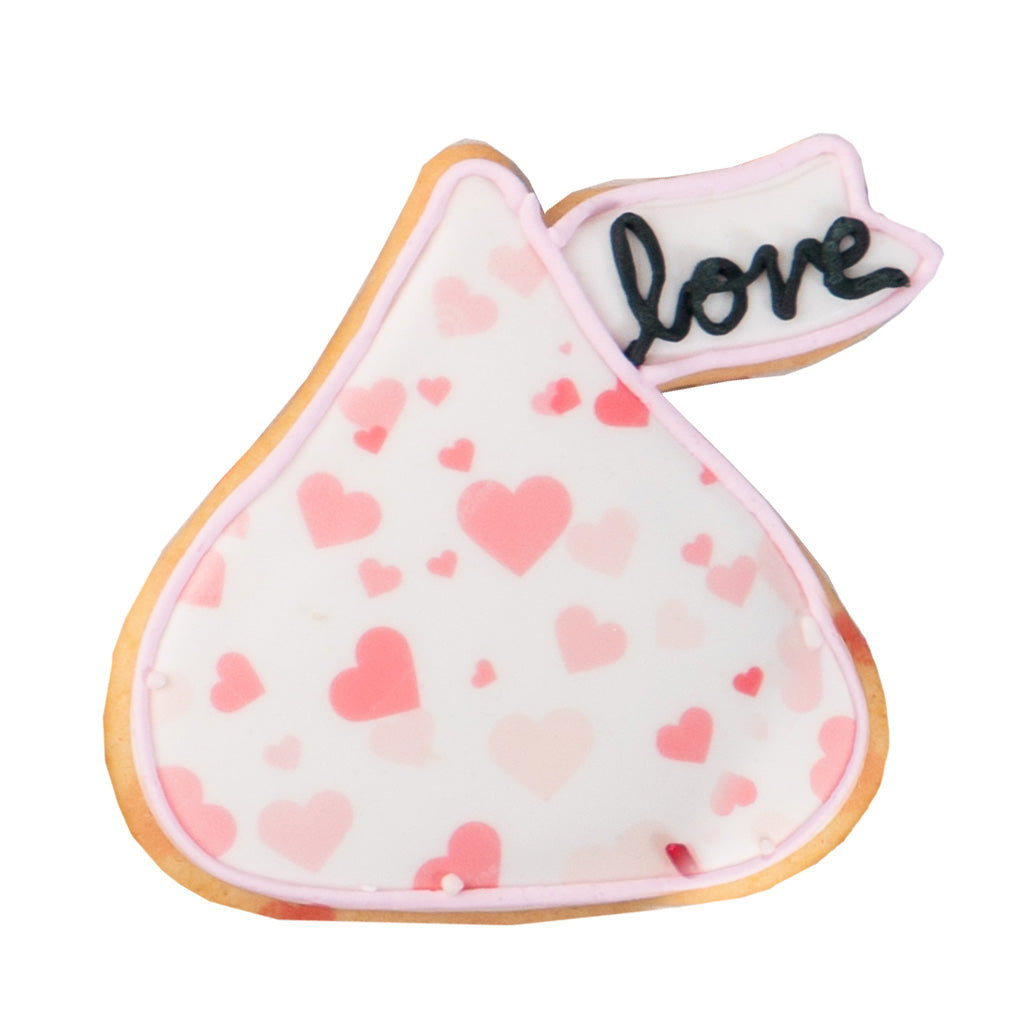 Valentine butter cookie shaped like a kiss with pink hearts