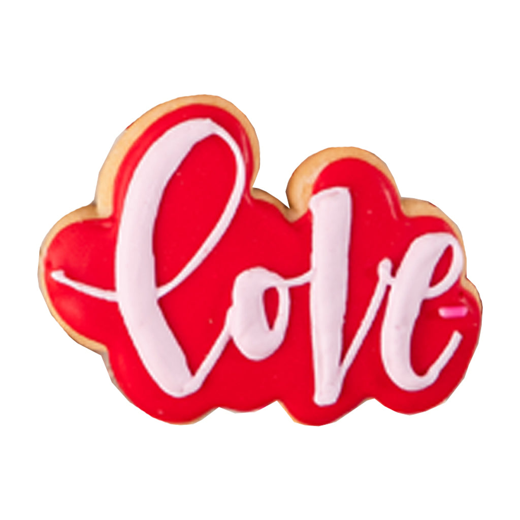 Valentine butter cookie shaped like red Love text with pink icing.