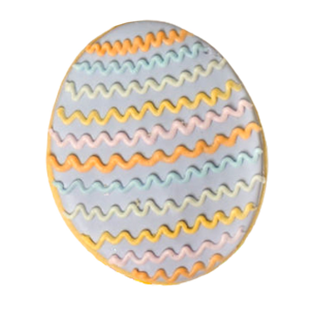 Easter butter cookie with purple icing and wavy pastel stripes