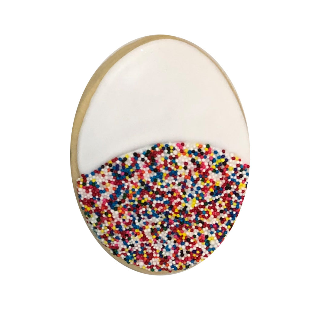 Doctors' Week oval cookie with white icing and sprinkles.