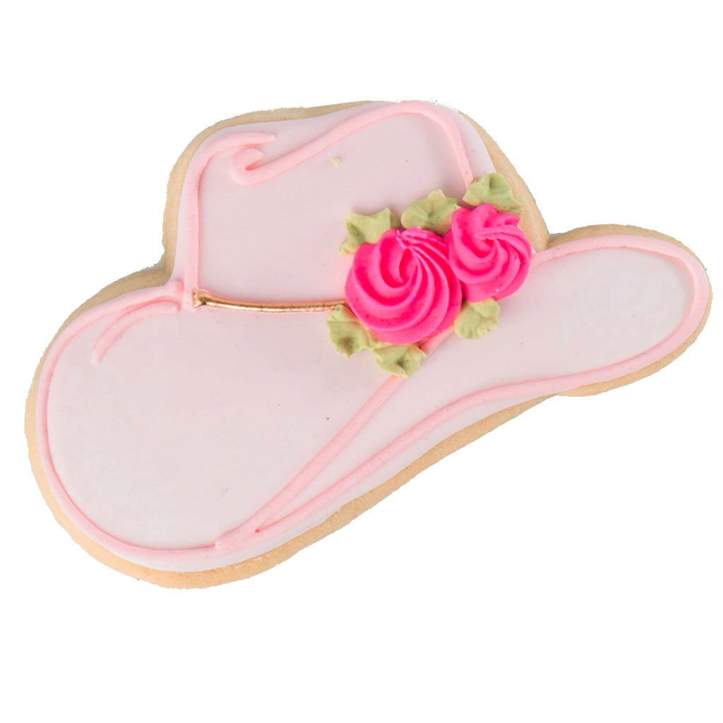 Pink cowboy hat sugar cookie with frosting roses.