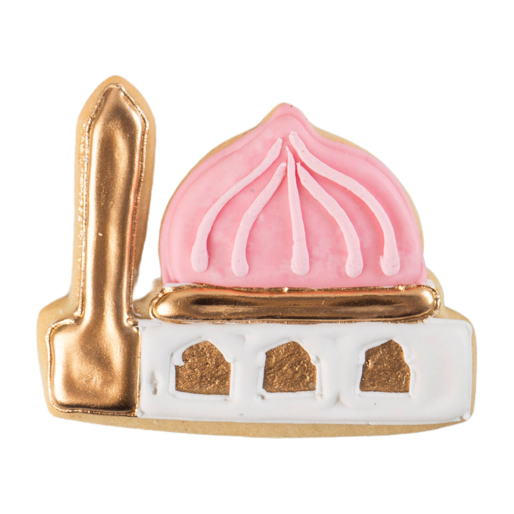 Mosque-shaped Ramadan butter cookie with pink and gold icing