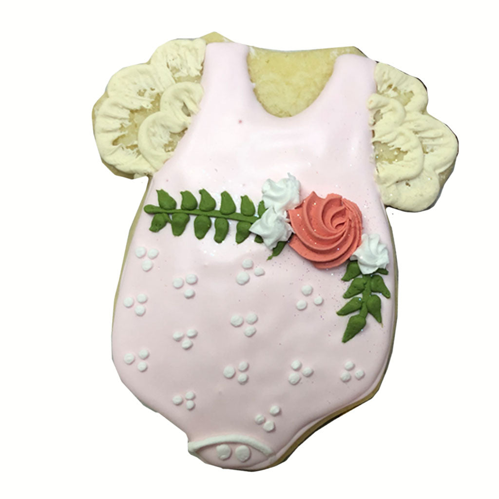Baby girl onesie cookie decorated with pink icing and a flower.