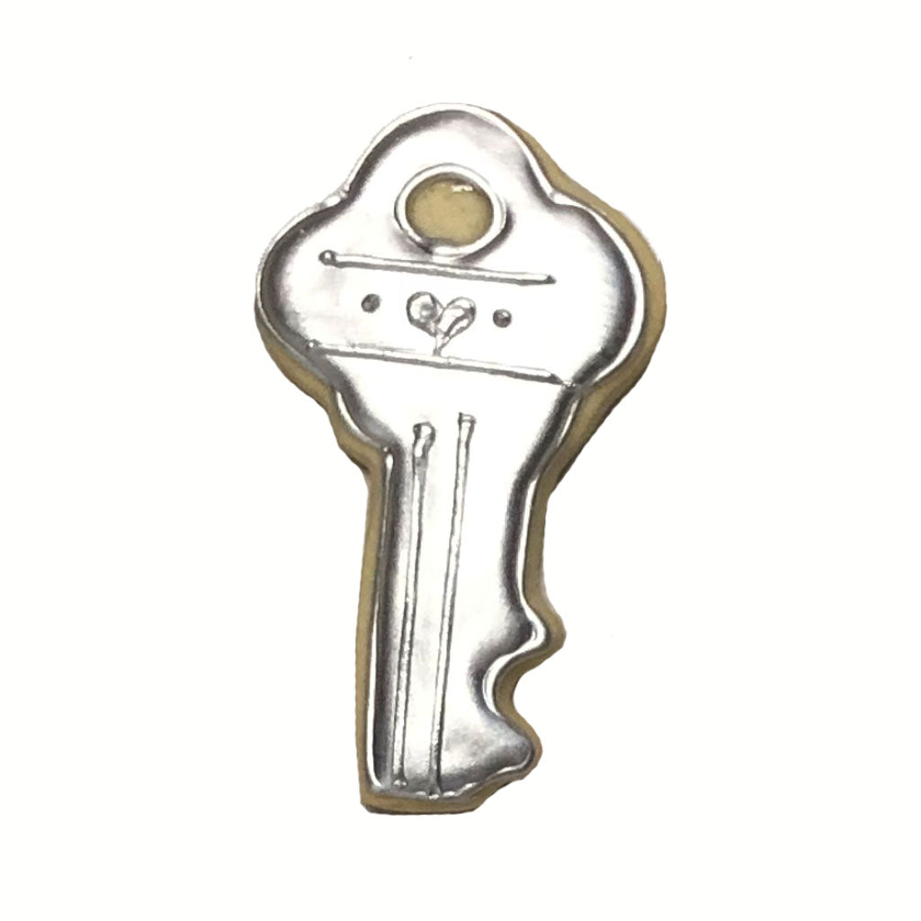 House key cookie decorated with metallic silver icing
