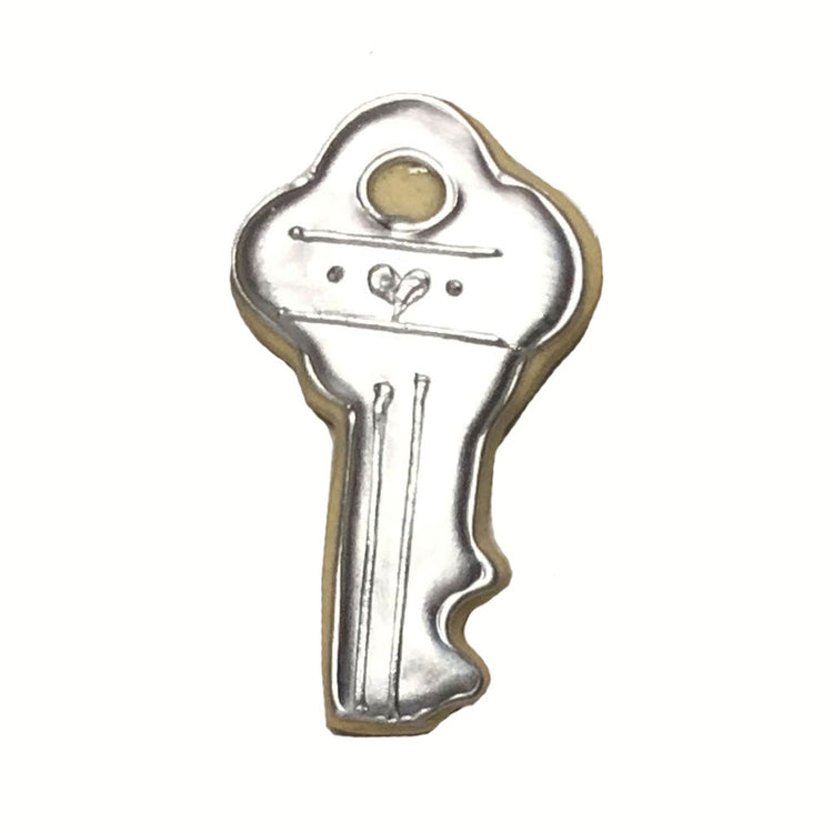 House key cookie decorated with metallic silver icing