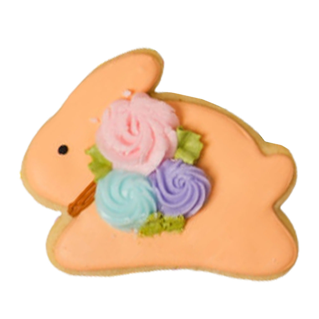 Easter butter cookie shaped like an orange bunny with frosting.