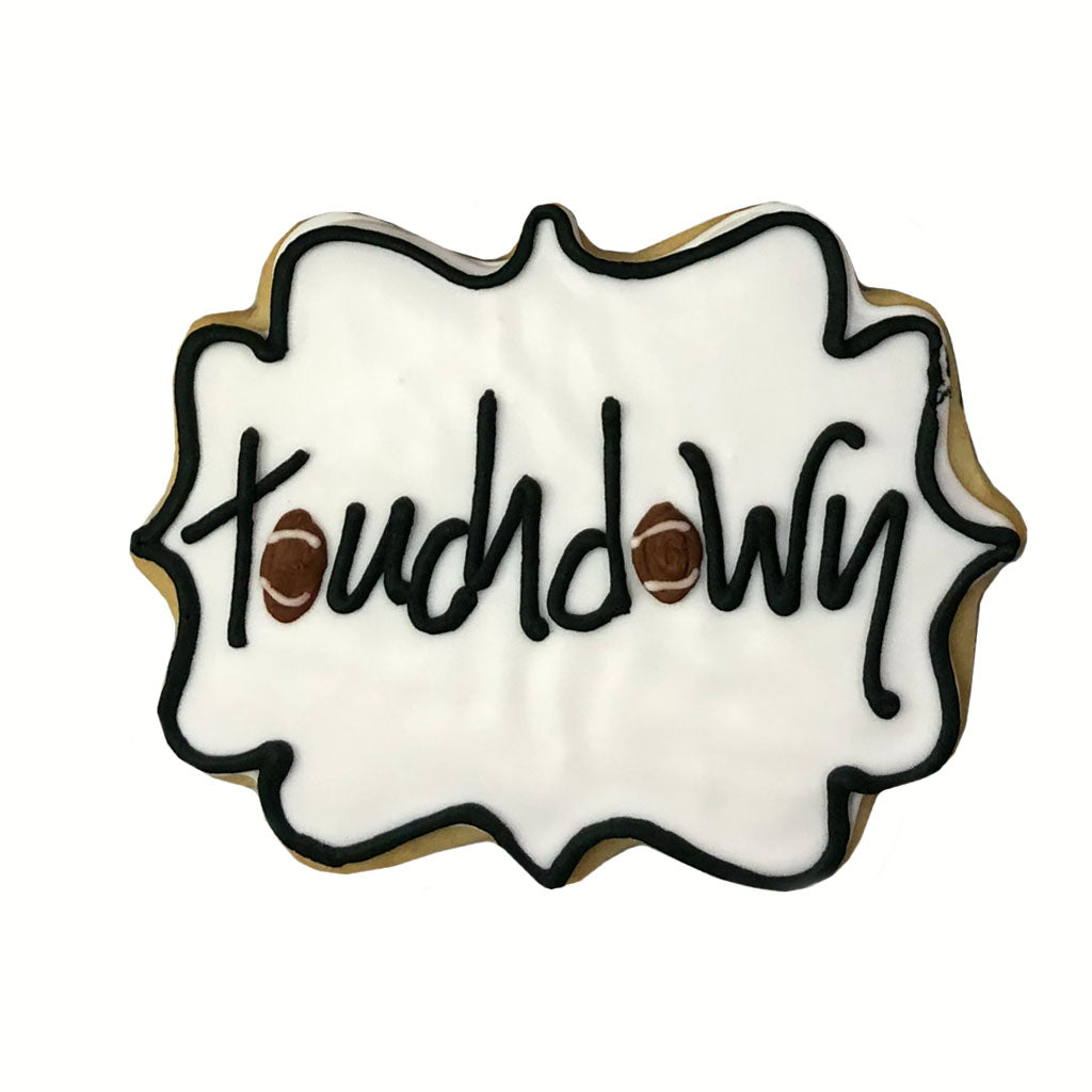 Football cookie with white icing and Touchdown text.