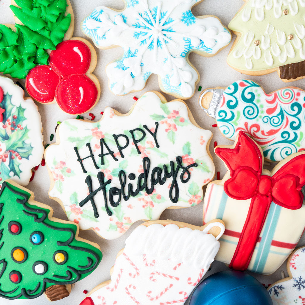 Assorted Christmas butter cookies with festive icing designs.