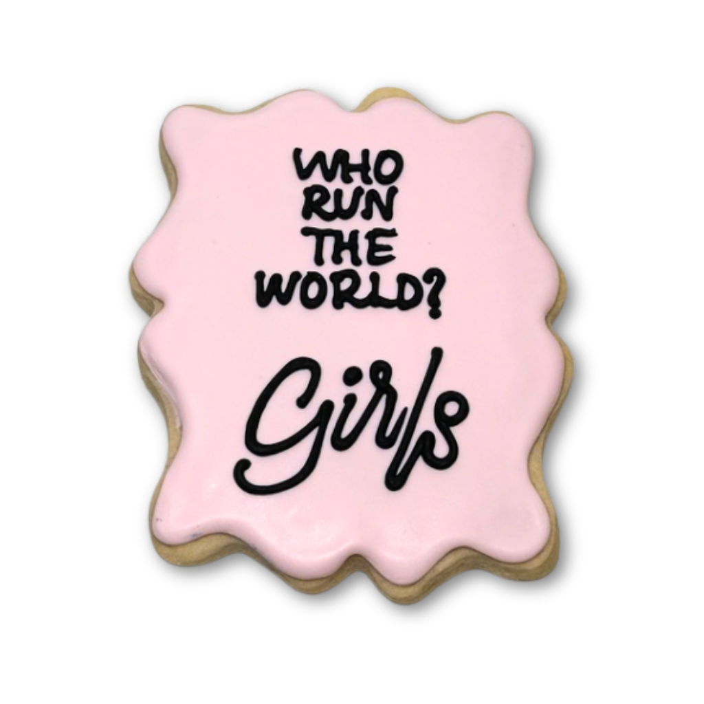 Women's History Month cookie with pink icing and black text.
