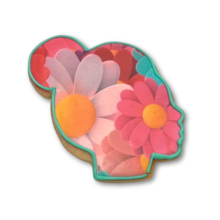 Women's History Month cookie with floral silhouette design