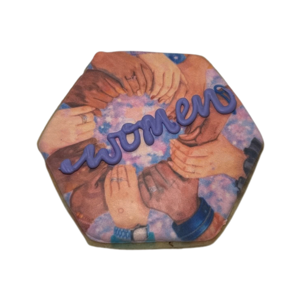 Hexagonal Women's History Month cookie with purple icing.