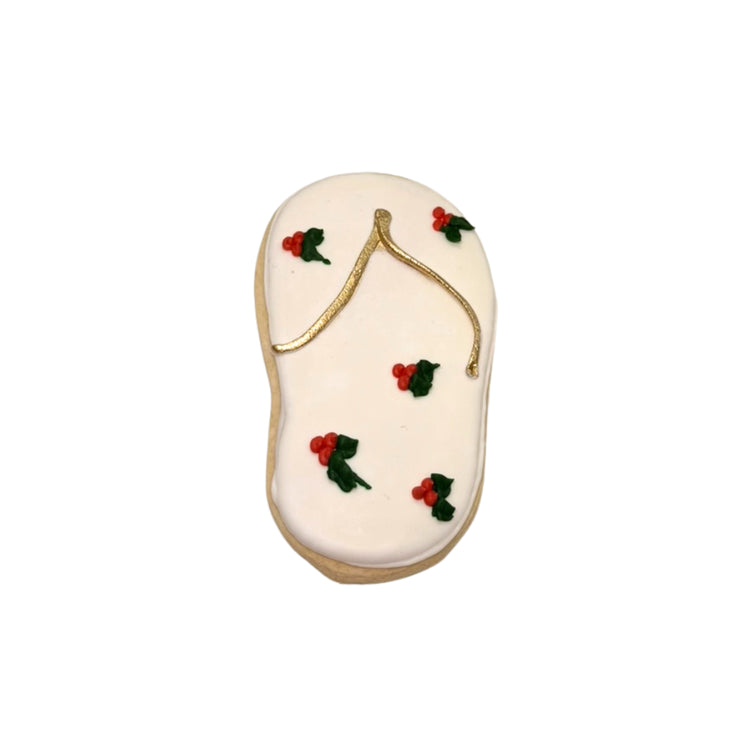 Christmas in July flip-flop cookie with holly icing.