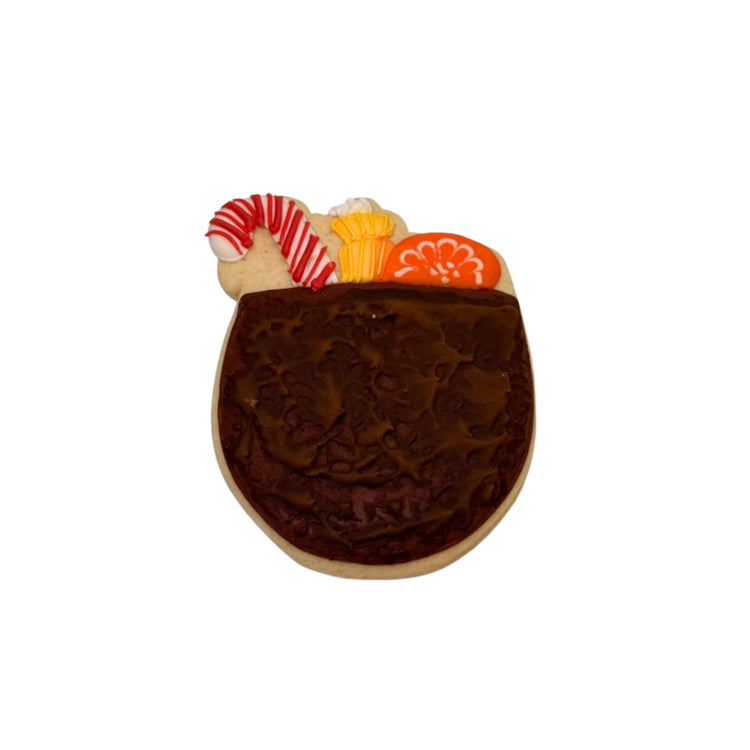 Christmas in July cookie decorated with candy cane and orange slice