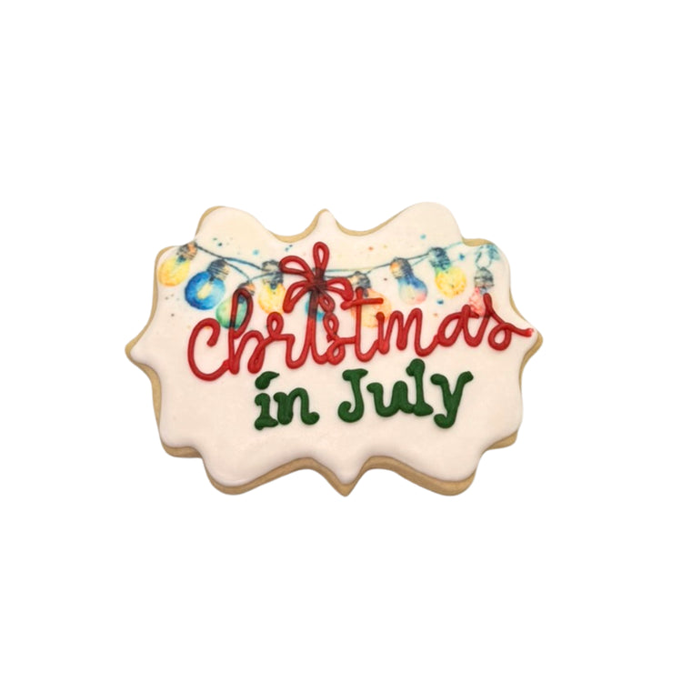 Christmas in July sugar cookie with colorful light bulb icing.