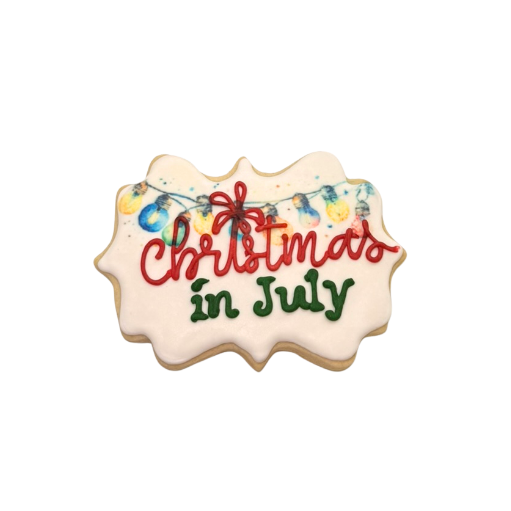 Christmas in July sugar cookie with colorful light bulb icing.