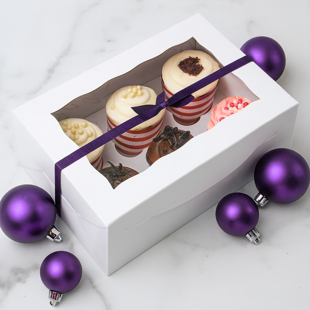6-pack cupcake gift box with a purple ribbon and ornaments.