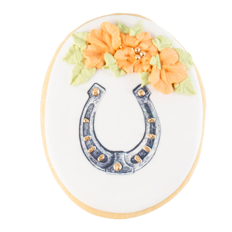 Barnyard Bites cookie with horseshoe and orange flowers