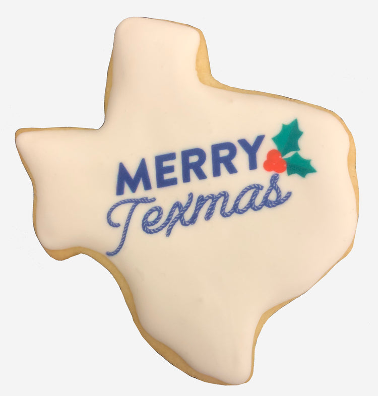 Texas-shaped cookie with Merry Texmas text and holly design.