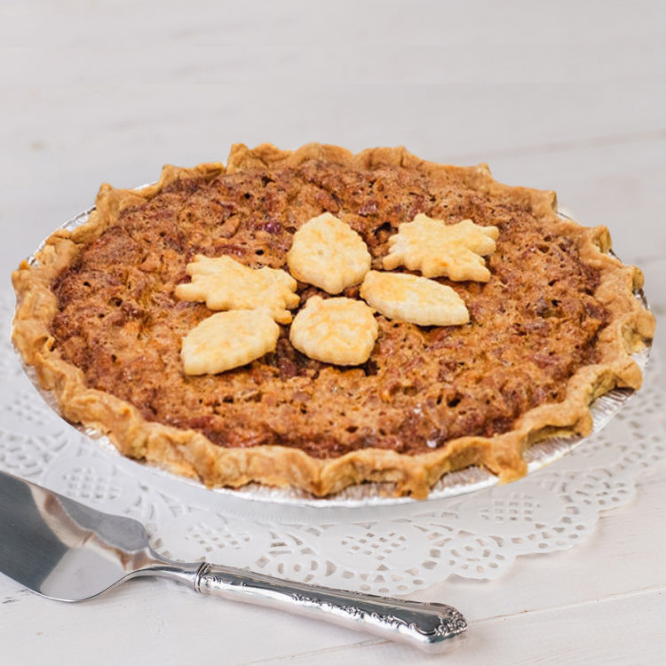 Southern Pecan Pie topped with decorative pastry leaves.